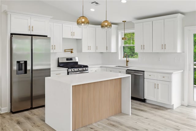 50 Rosemont Ave, Johnston, RI 02919 - kitchen with appliances with stainless steel finishes, white cabinetry, light wood finished floors, recessed lighting, and light countertops