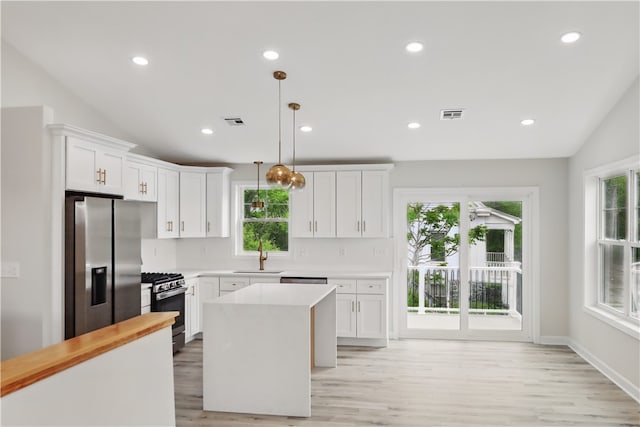 50 Rosemont Ave, Johnston, RI 02919 - kitchen featuring appliances with stainless steel finishes, plenty of natural light, light wood-style flooring, recessed lighting, and lofted ceiling