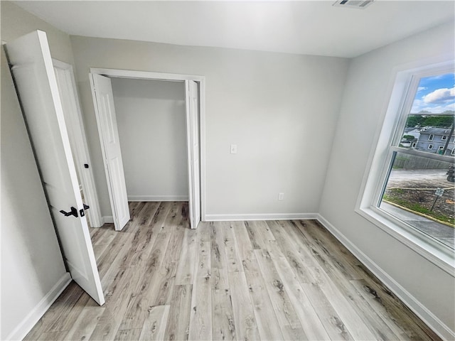 50 Rosemont Ave, Johnston, RI 02919 - unfurnished bedroom with light wood-type flooring and a closet