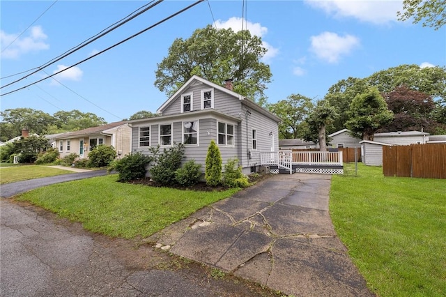 100 Pine Grove St, East Providence, RI 02916 - view of front of house with a chimney and driveway