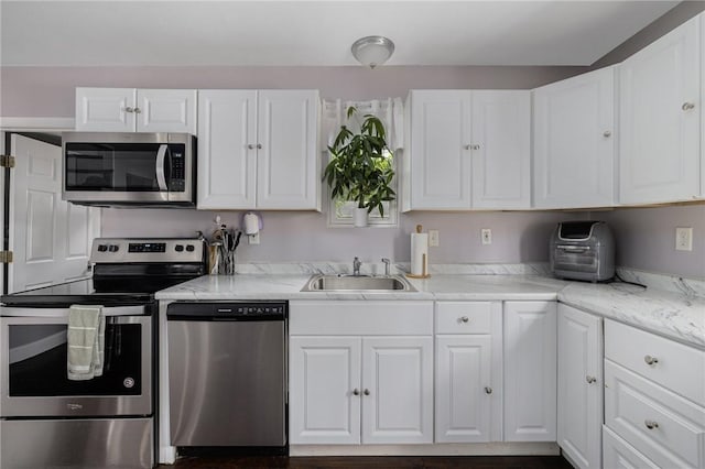 100 Pine Grove St, East Providence, RI 02916 - kitchen with stainless steel appliances and white cabinetry