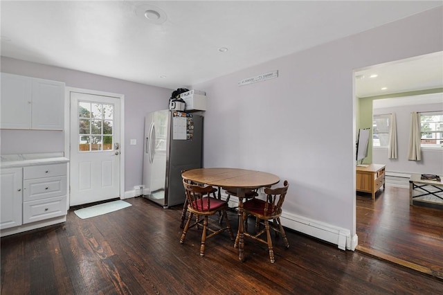100 Pine Grove St, East Providence, RI 02916 - dining area with dark wood finished floors, a baseboard heating unit, and recessed lighting