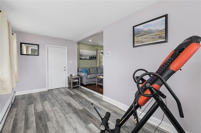 100 Pine Grove St, East Providence, RI 02916 - exercise area with wood finished floors, a baseboard radiator, and recessed lighting