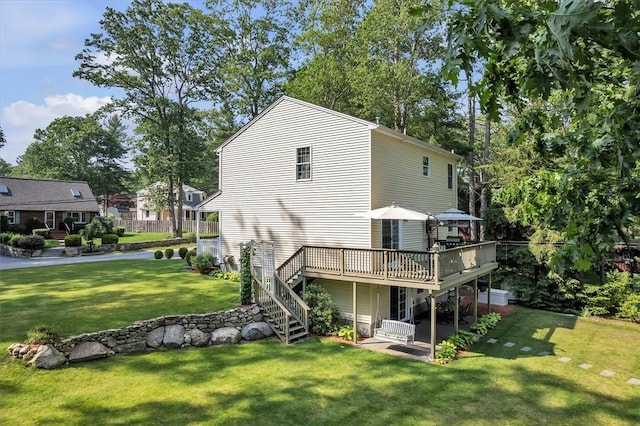 21 Laurel Dr, Glocester, RI 02814 - rear view of house with a wooden deck, a lawn, and stairway