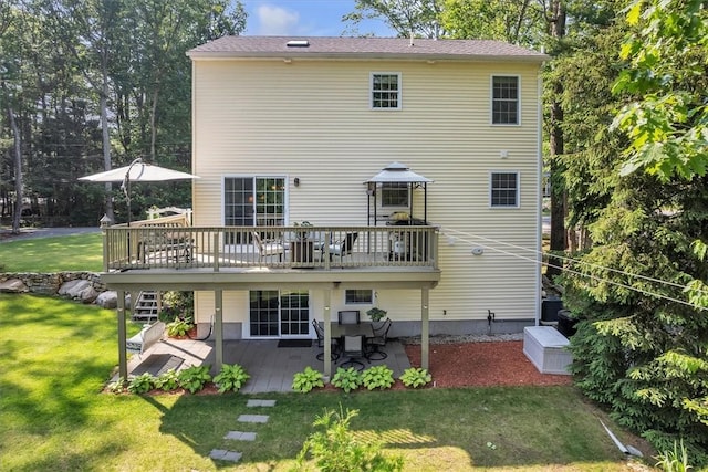21 Laurel Dr, Glocester, RI 02814 - rear view of house featuring a wooden deck, a lawn, and a patio area