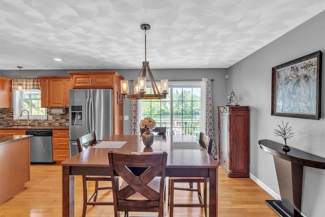 21 Laurel Dr, Glocester, RI 02814 - dining area with a chandelier, healthy amount of natural light, light wood-style flooring, and recessed lighting
