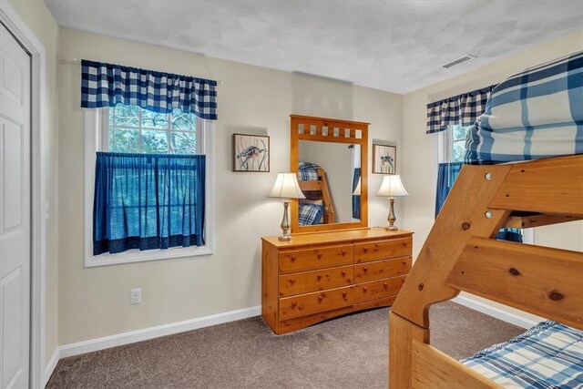 21 Laurel Dr, Glocester, RI 02814 - carpeted bedroom featuring multiple windows