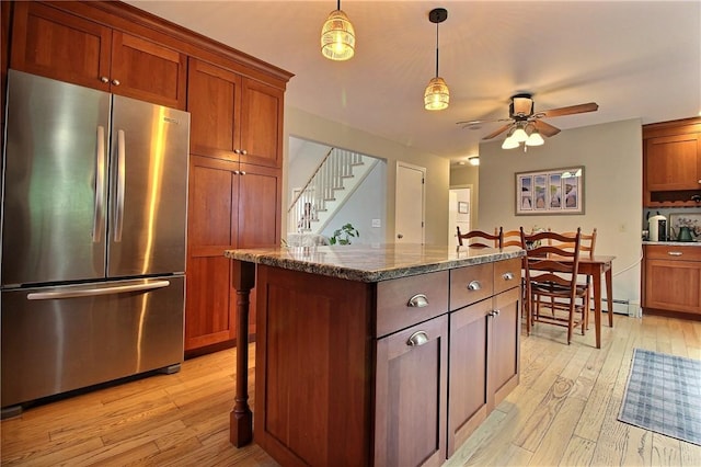 10 N Dr, Westerly, RI 02891 - kitchen with freestanding refrigerator, light wood-type flooring, a ceiling fan, and hanging light fixtures