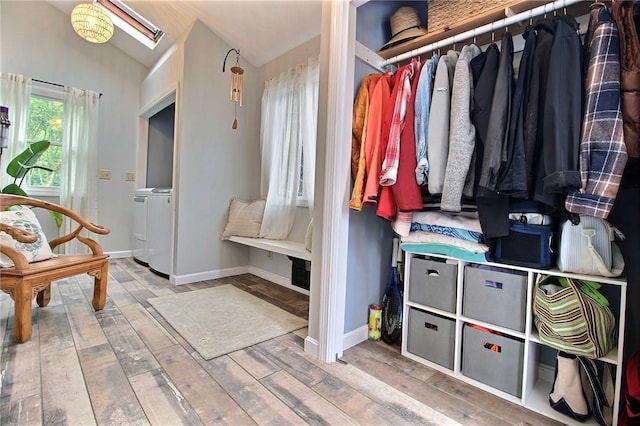 10 N Dr, Westerly, RI 02891 - spacious closet featuring lofted ceiling, wood finished floors, and washing machine and dryer
