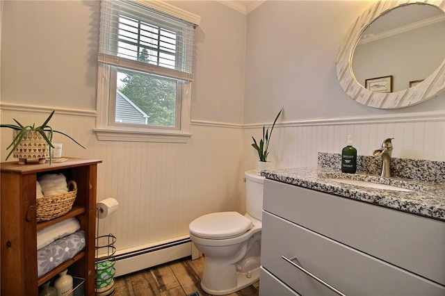 10 N Dr, Westerly, RI 02891 - half bath featuring a baseboard radiator, wainscoting, vanity, wood finished floors, and ornamental molding