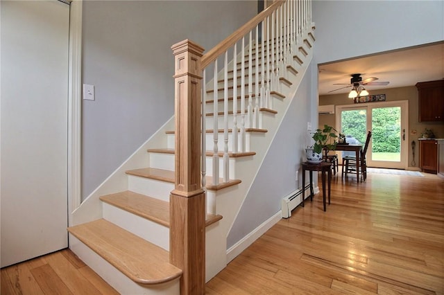 10 N Dr, Westerly, RI 02891 - stairs featuring baseboard heating, wood finished floors, and a ceiling fan