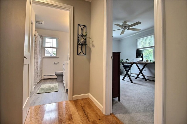 10 N Dr, Westerly, RI 02891 - hallway featuring baseboard heating and wood finished floors