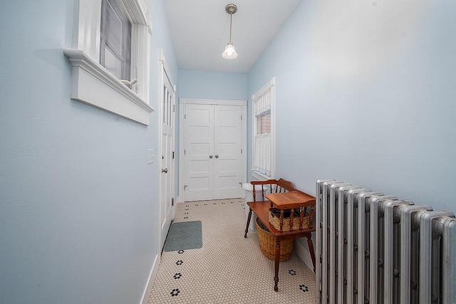 40 Vine St, East Greenwich, RI 02818 - entryway featuring radiator and baseboards