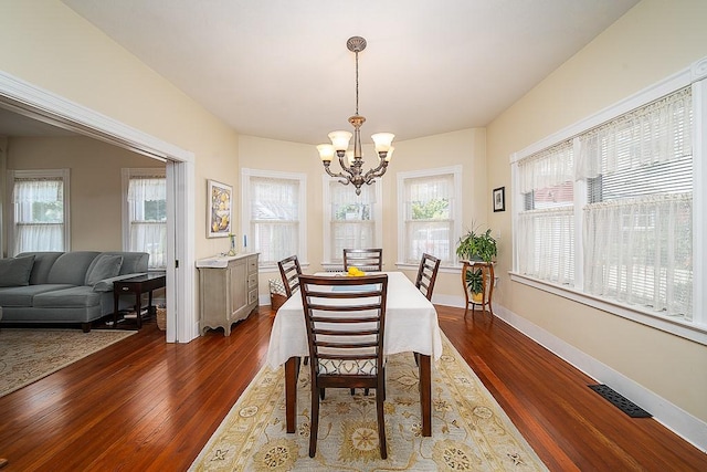 40 Vine St, East Greenwich, RI 02818 - dining area with a chandelier and dark wood finished floors