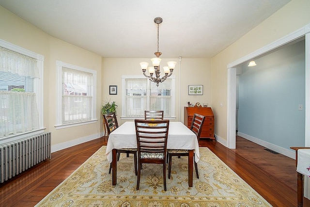 40 Vine St, East Greenwich, RI 02818 - dining area with radiator heating unit, a chandelier, and dark wood finished floors