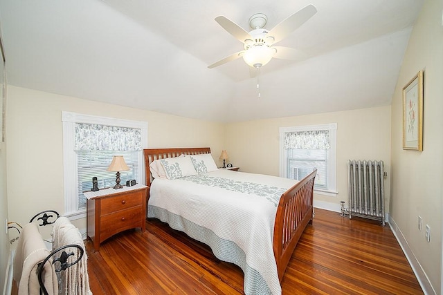 40 Vine St, East Greenwich, RI 02818 - bedroom with radiator heating unit, dark wood-style floors, lofted ceiling, and ceiling fan