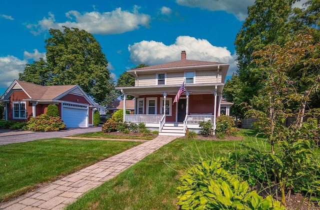 40 Vine St, East Greenwich, RI 02818 - american foursquare style home featuring a chimney, covered porch, a front lawn, asphalt driveway, and a garage