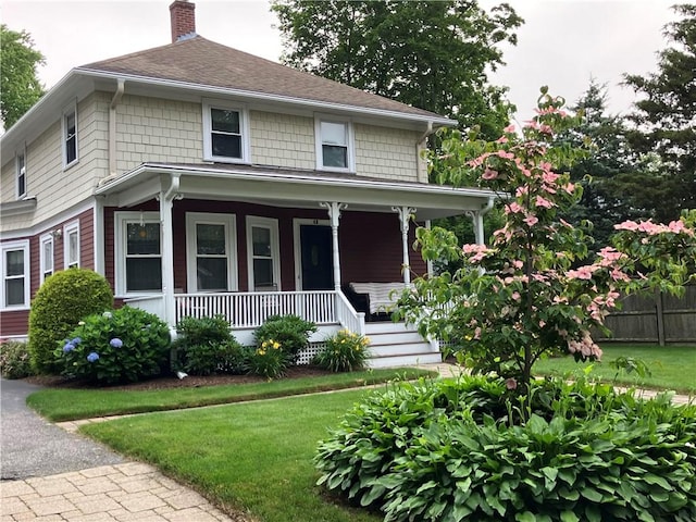 40 Vine St, East Greenwich, RI 02818 - view of front of house with a chimney, covered porch, and a shingled roof