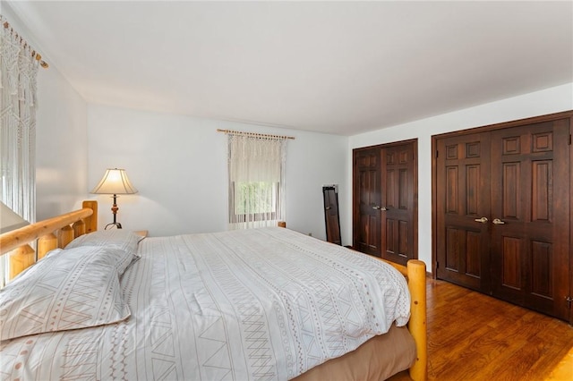 1451 Ministerial Rd, South Kingstown, RI 02879 - bedroom with two closets and wood finished floors