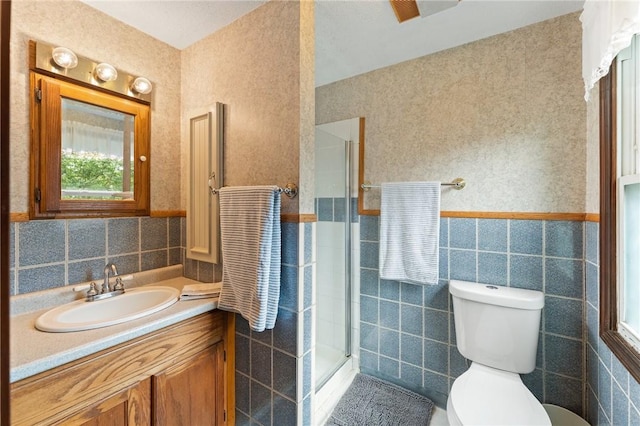 1451 Ministerial Rd, South Kingstown, RI 02879 - full bathroom featuring tile walls, vanity, a shower stall, and wainscoting