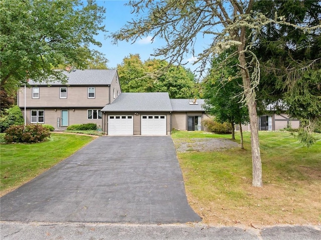 1451 Ministerial Rd, South Kingstown, RI 02879 - colonial home with an attached garage, driveway, and a front yard