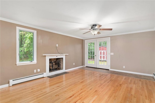 9 Esek Hopkins Rd, Scituate, RI 02857 - unfurnished living room featuring a baseboard radiator, ceiling fan, wood finished floors, a fireplace with flush hearth, and healthy amount of natural light