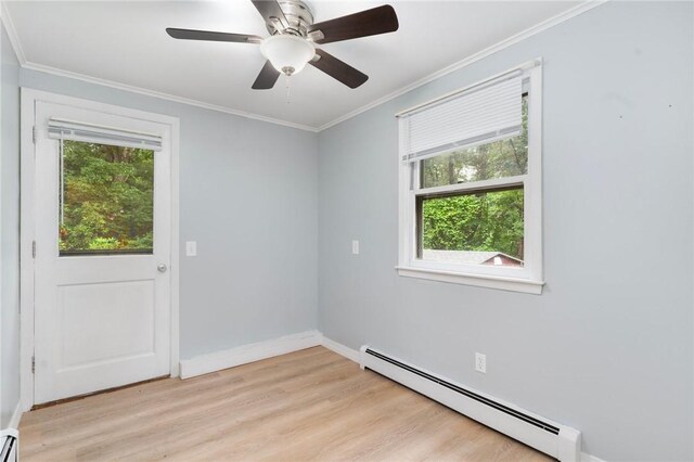 9 Esek Hopkins Rd, Scituate, RI 02857 - empty room featuring baseboard heating, plenty of natural light, light wood-style floors, and ornamental molding