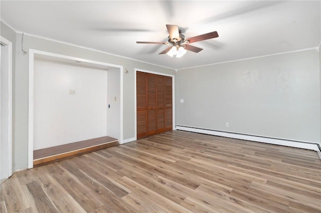 9 Esek Hopkins Rd, Scituate, RI 02857 - empty room featuring baseboard heating, ornamental molding, a ceiling fan, and light wood-style flooring