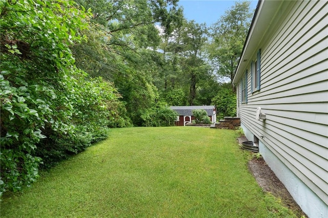 9 Esek Hopkins Rd, Scituate, RI 02857 - view of grassy yard featuring an outdoor structure