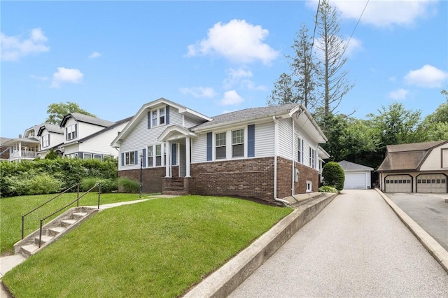 107 Meadow Rd, Woonsocket, RI 02895 - view of front of home with brick siding, a garage, a front yard, and an outdoor structure