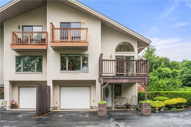 97 Farnum Pike Unit 7, Smithfield, RI 02917 - rear view of property with a balcony, a garage, and driveway