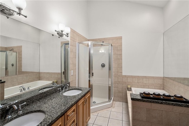 97 Farnum Pike Unit 7, Smithfield, RI 02917 - bathroom with tile walls, a bath, a stall shower, tile patterned flooring, and double vanity