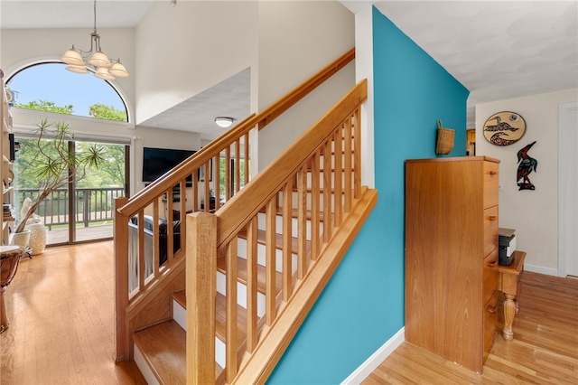 97 Farnum Pike Unit 7, Smithfield, RI 02917 - stairway with wood finished floors and a chandelier