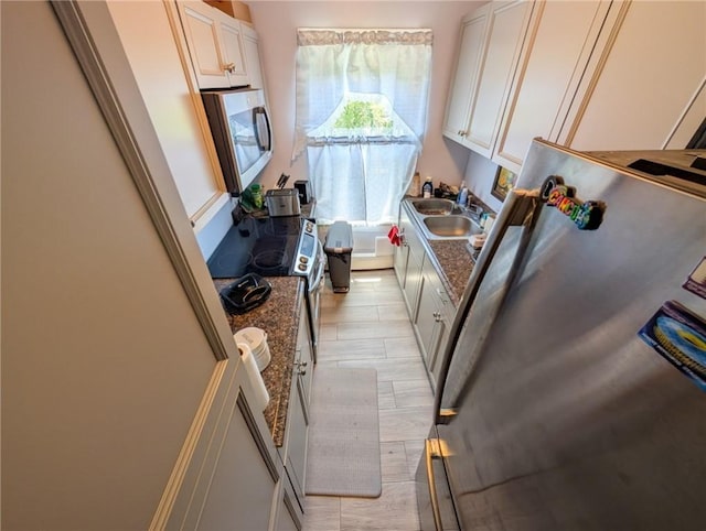 5 Stearns St, Pawtucket, RI 02861 - kitchen with appliances with stainless steel finishes, white cabinetry, and dark stone counters