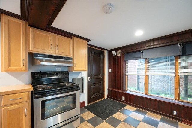 10 Hendricks St, South Kingstown, RI 02879 - kitchen with stainless steel range with electric stovetop, under cabinet range hood, tile patterned floors, light brown cabinets, and light countertops