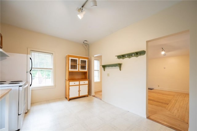 10 Hendricks St, South Kingstown, RI 02879 - kitchen with rail lighting, white electric range, and plenty of natural light