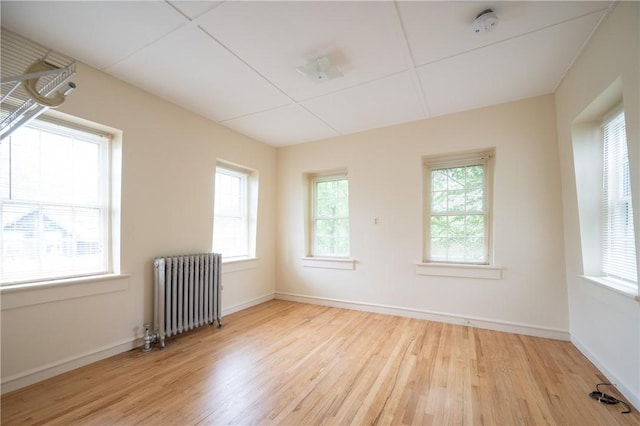 10 Hendricks St, South Kingstown, RI 02879 - unfurnished room with radiator heating unit, wood finished floors, and a smoke detector