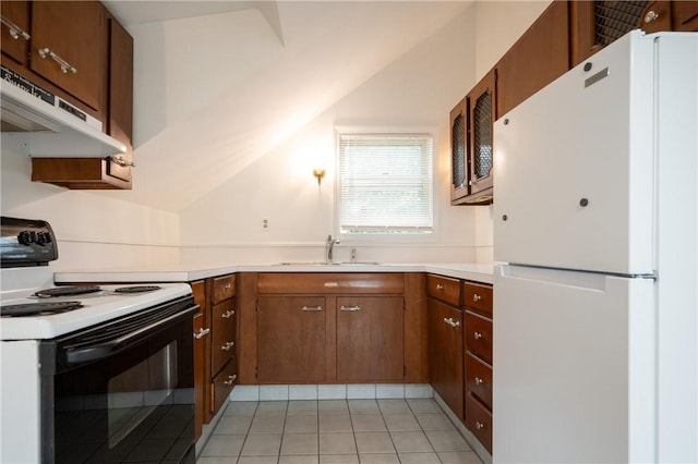 10 Hendricks St, South Kingstown, RI 02879 - kitchen featuring freestanding refrigerator, range with electric cooktop, under cabinet range hood, light countertops, and light tile patterned flooring