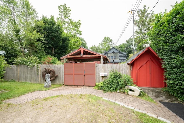 10 Hendricks St, South Kingstown, RI 02879 - view of yard with a gate and a storage unit