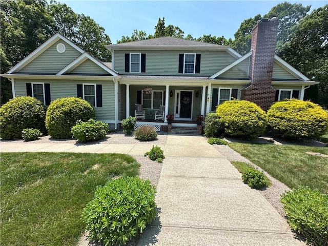 14 Piezzo Dr, Westerly, RI 02891 - traditional home with covered porch and a front yard