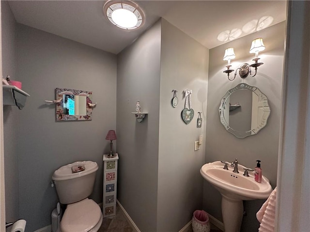 14 Piezzo Dr, Westerly, RI 02891 - bathroom featuring toilet and baseboards