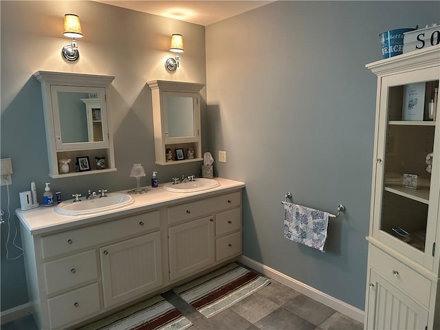 14 Piezzo Dr, Westerly, RI 02891 - bathroom featuring double vanity and baseboards
