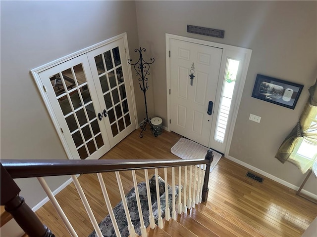 14 Piezzo Dr, Westerly, RI 02891 - foyer with wood finished floors, french doors, and plenty of natural light