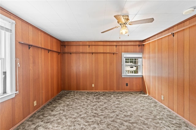 34 Tilden Ave, Warwick, RI 02888 - carpeted spare room with a smoke detector, ceiling fan, and wood walls