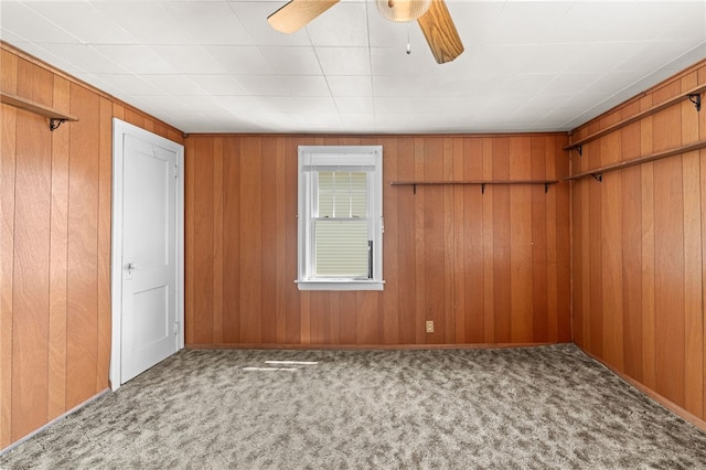 34 Tilden Ave, Warwick, RI 02888 - unfurnished bedroom featuring carpet, wooden walls, and a ceiling fan