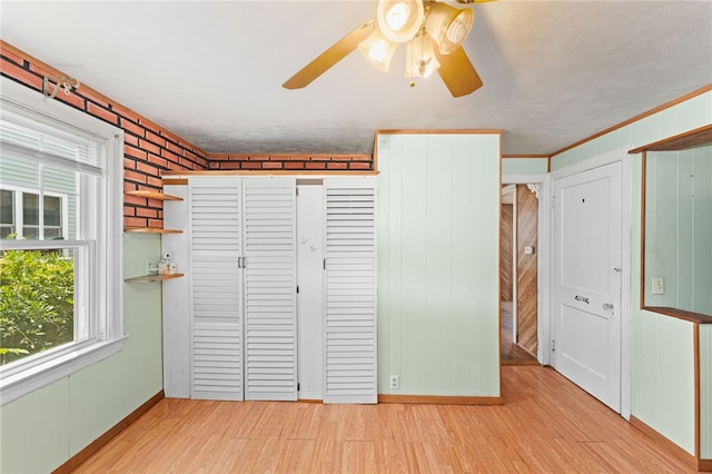 34 Tilden Ave, Warwick, RI 02888 - unfurnished bedroom featuring light wood-style flooring, a ceiling fan, and a closet