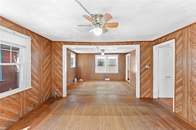 34 Tilden Ave, Warwick, RI 02888 - spare room featuring wood walls, hardwood / wood-style flooring, and ceiling fan
