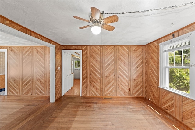 34 Tilden Ave, Warwick, RI 02888 - spare room featuring wooden walls, ceiling fan, and wood-type flooring