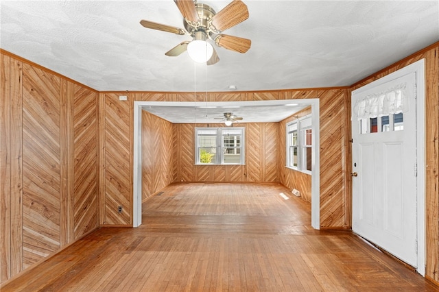34 Tilden Ave, Warwick, RI 02888 - foyer entrance with hardwood / wood-style floors, wooden walls, and a ceiling fan