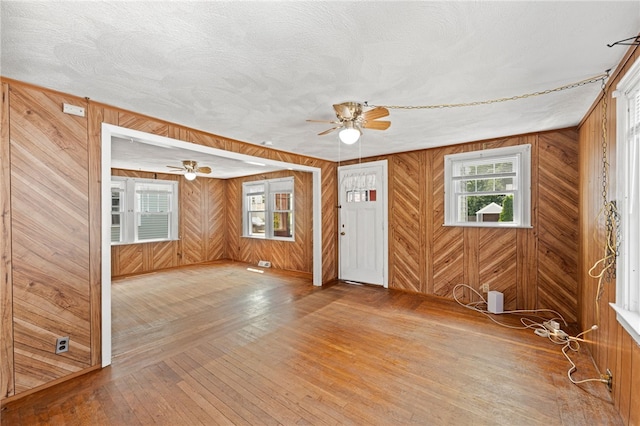 34 Tilden Ave, Warwick, RI 02888 - foyer featuring ceiling fan, wood walls, and wood-type flooring